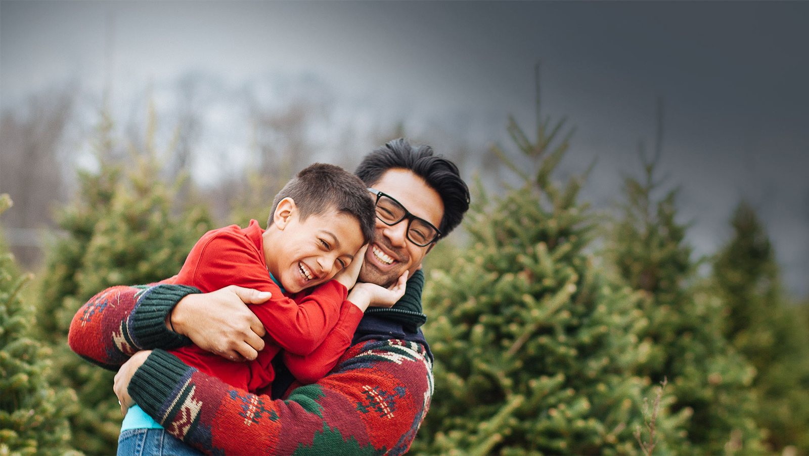 A father and son hugging